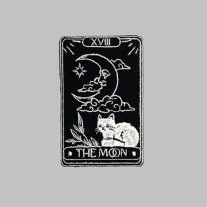 black and white embroidery patch of the moon tarot card