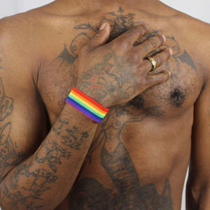 Elastic Rainbow Wristband worn by beautiful black tattooed model.
