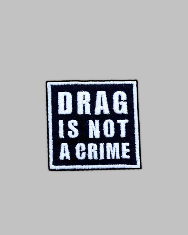 Drag is not a crime embroidery patch. Iron on embroidery Patch. white thread against black fabric.