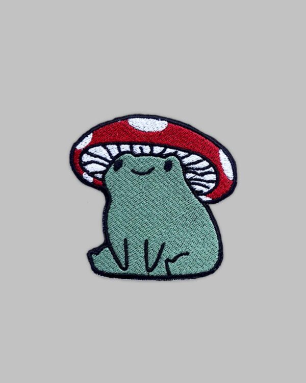 deep green frog with mushroom cap upon its head. Mushroom Frog embroidery patch