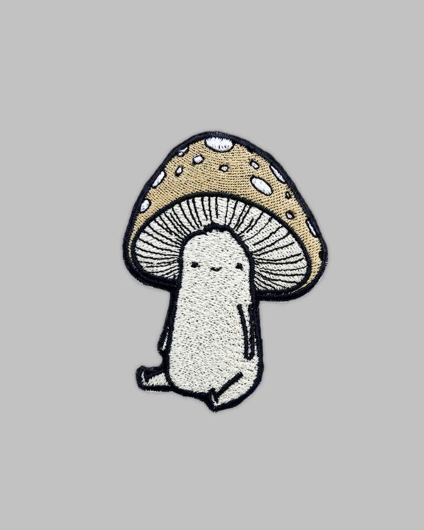 Mushroom Guy Patch. Embroidery patch of a tan colored mushroom friend sitting down